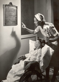 Little boy with plaque